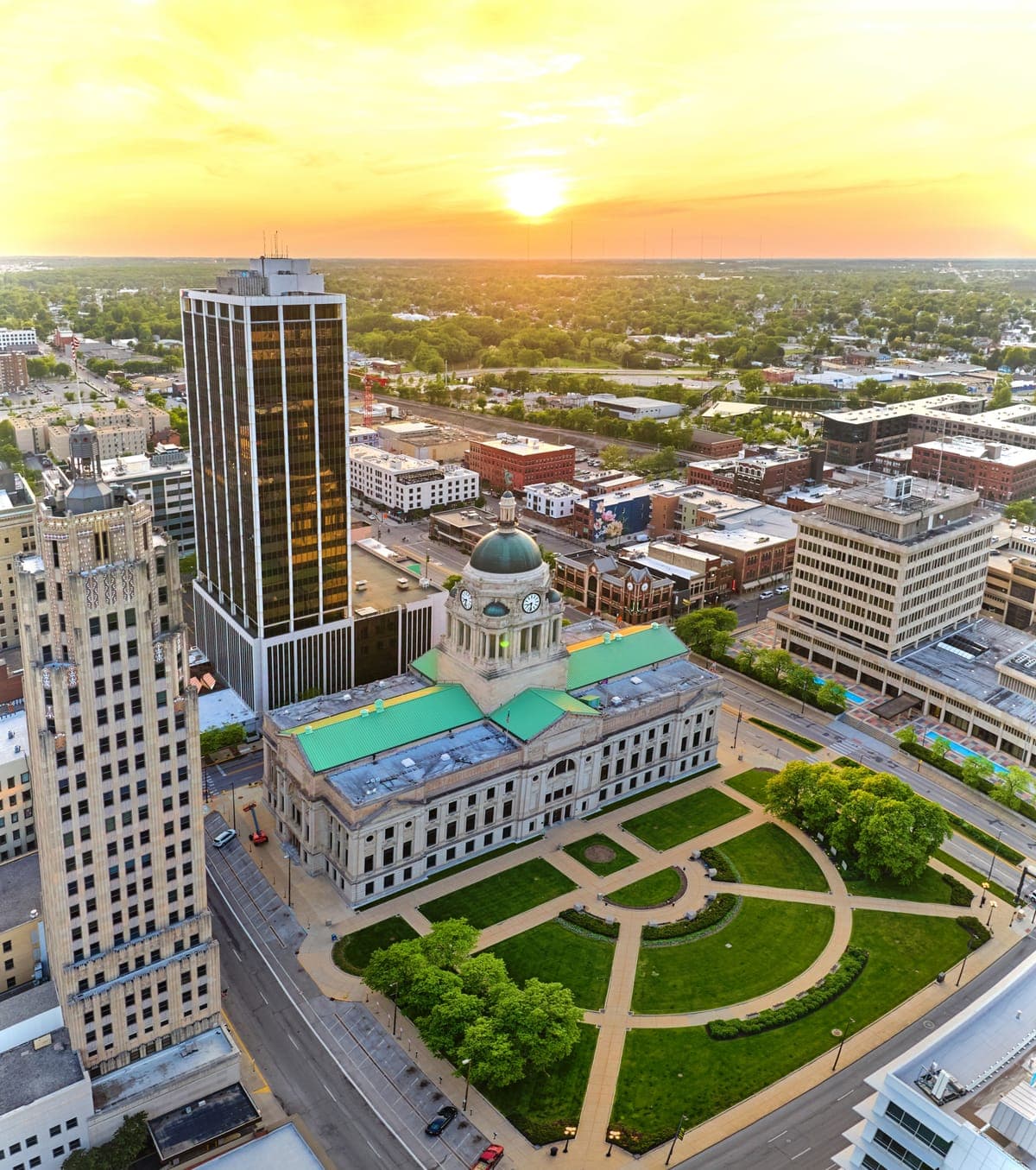 Sunrise over downtown Fort Wayne, framed by the shape of Indiana